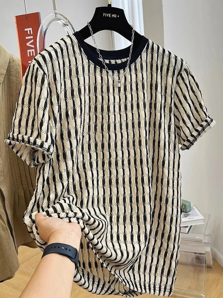 Black men's loose-fitting striped short sleeve pullover top made from silk and linen blend.