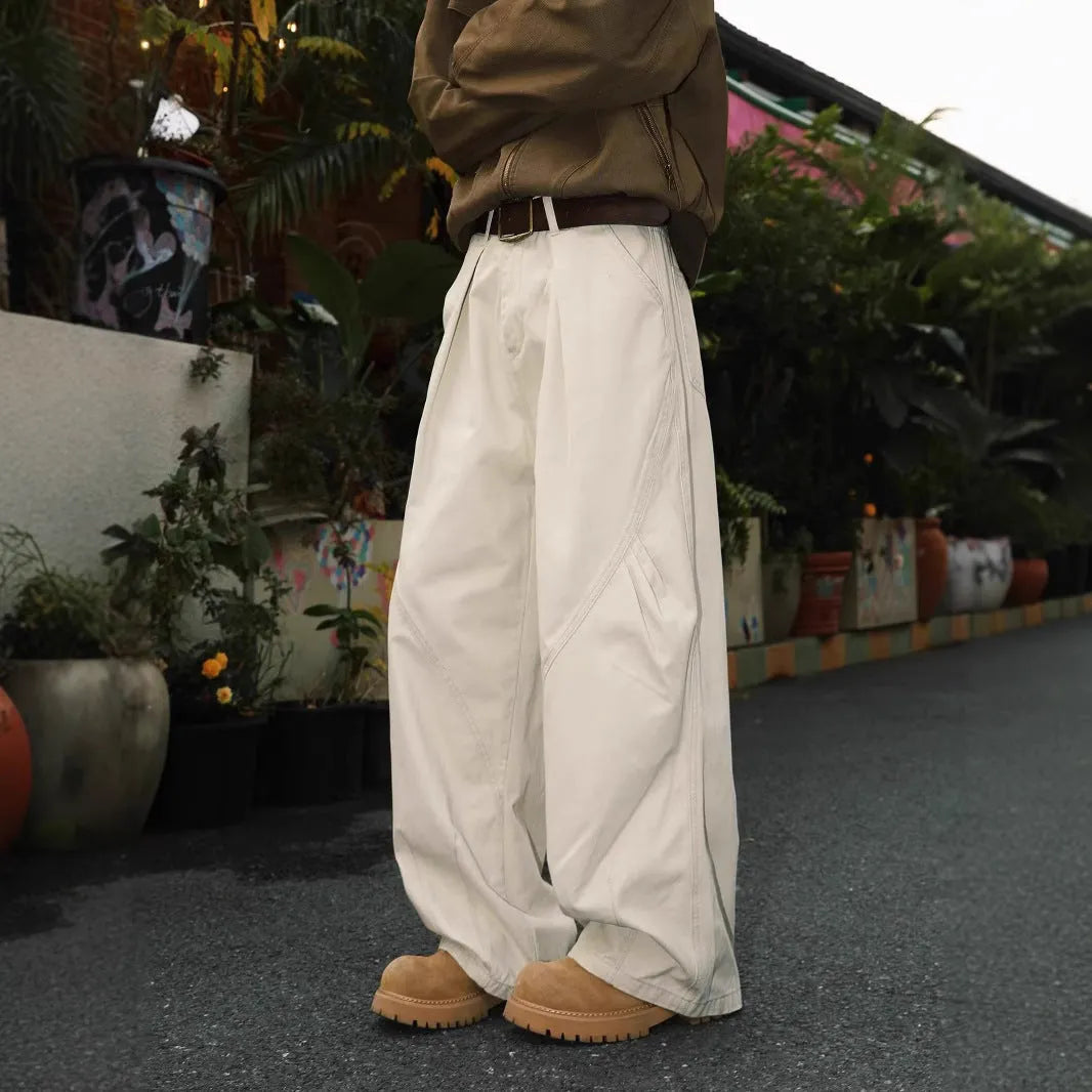 Men's pleated straight leg trousers in stripe patterns showing loose fit and micro elastic fabric