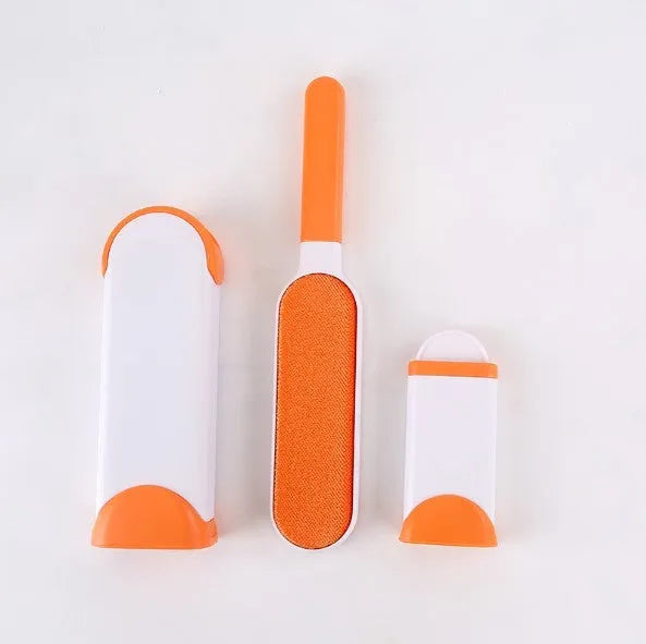 Blue reusable pet hair removal brush with sticky flannel head placed in its self-cleaning base.