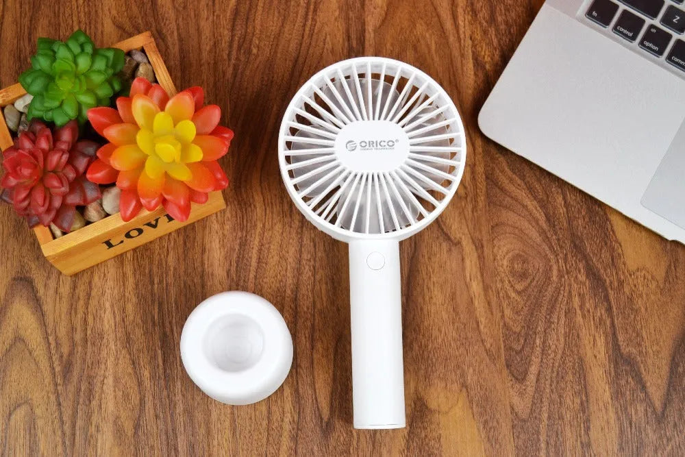 White ORICO FH1 USB rechargeable portable handheld and desktop fan with fine-line detailing.