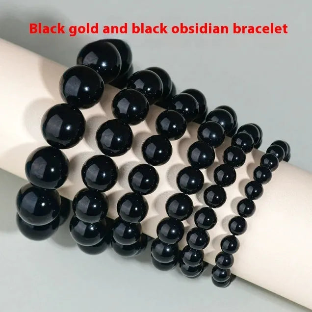 Hand-woven round obsidian bead bracelet for couples, showing colour options on a wrist.