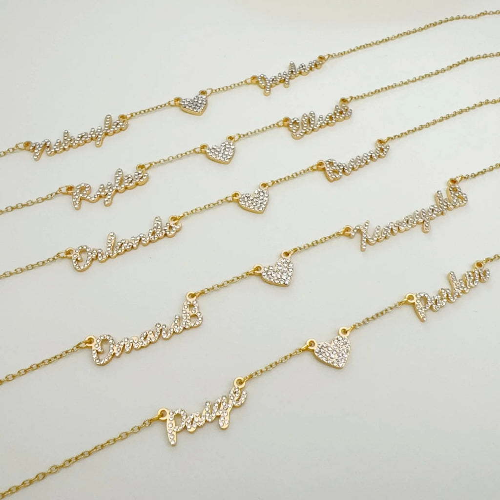 Customised diamond inlaid multi name necklace on stainless steel O-shaped chain, gold finish, with heart charms