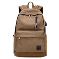 Canvas backpack with USB charging port shown in coffee colour, featuring a laptop compartment and multiple pockets.