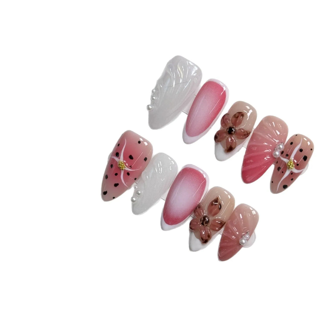 Three-dimensional carved nail art patches with hand-painted designs for almond-shaped nails