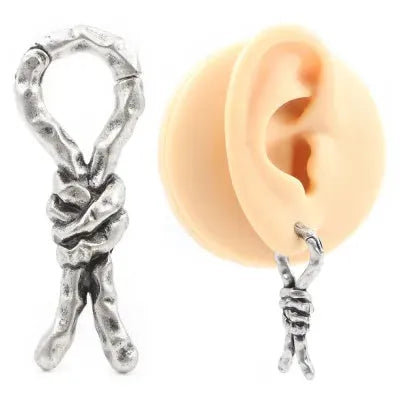 Close-up of copper earrings with a 4mm gauge featuring intricate bends and hitches design