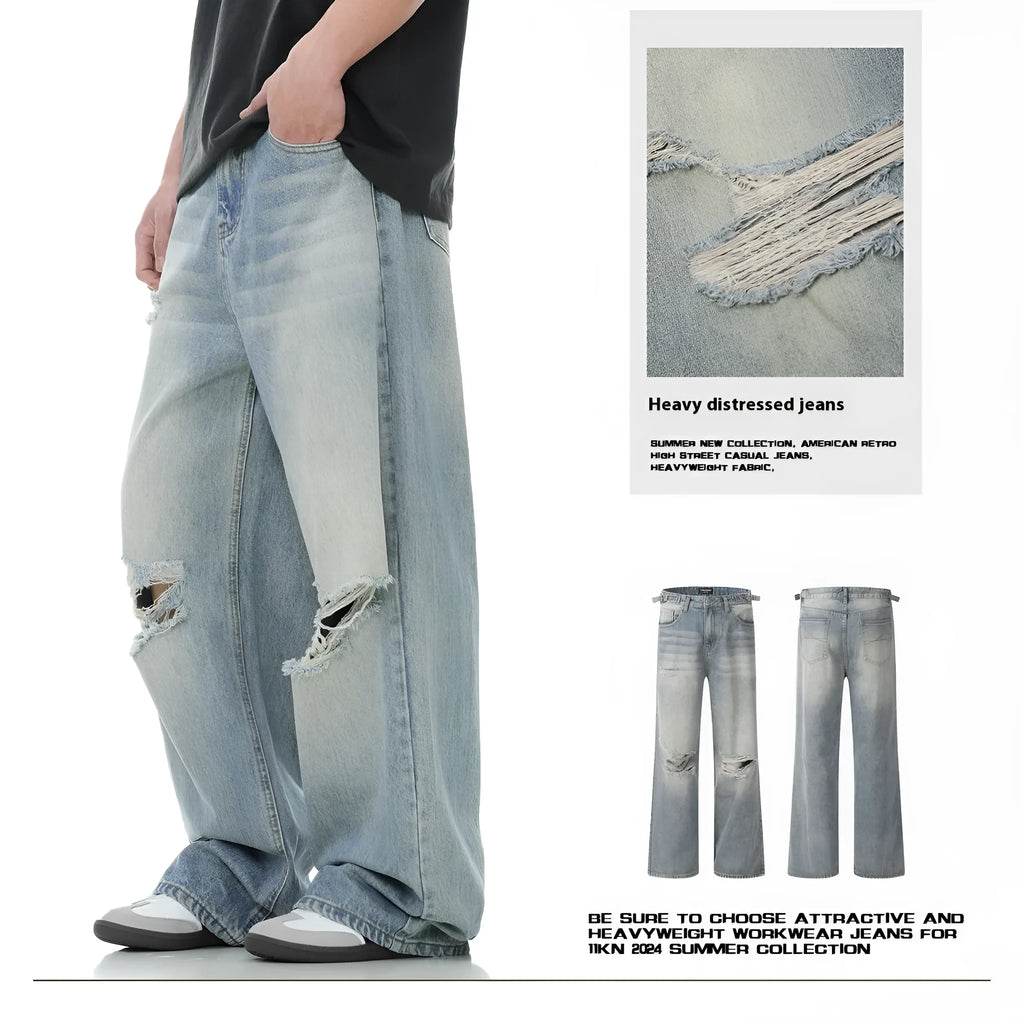 Blue men's straight-leg ripped jeans on a neutral background, showing the cotton blend fabric and zipper fly detail.