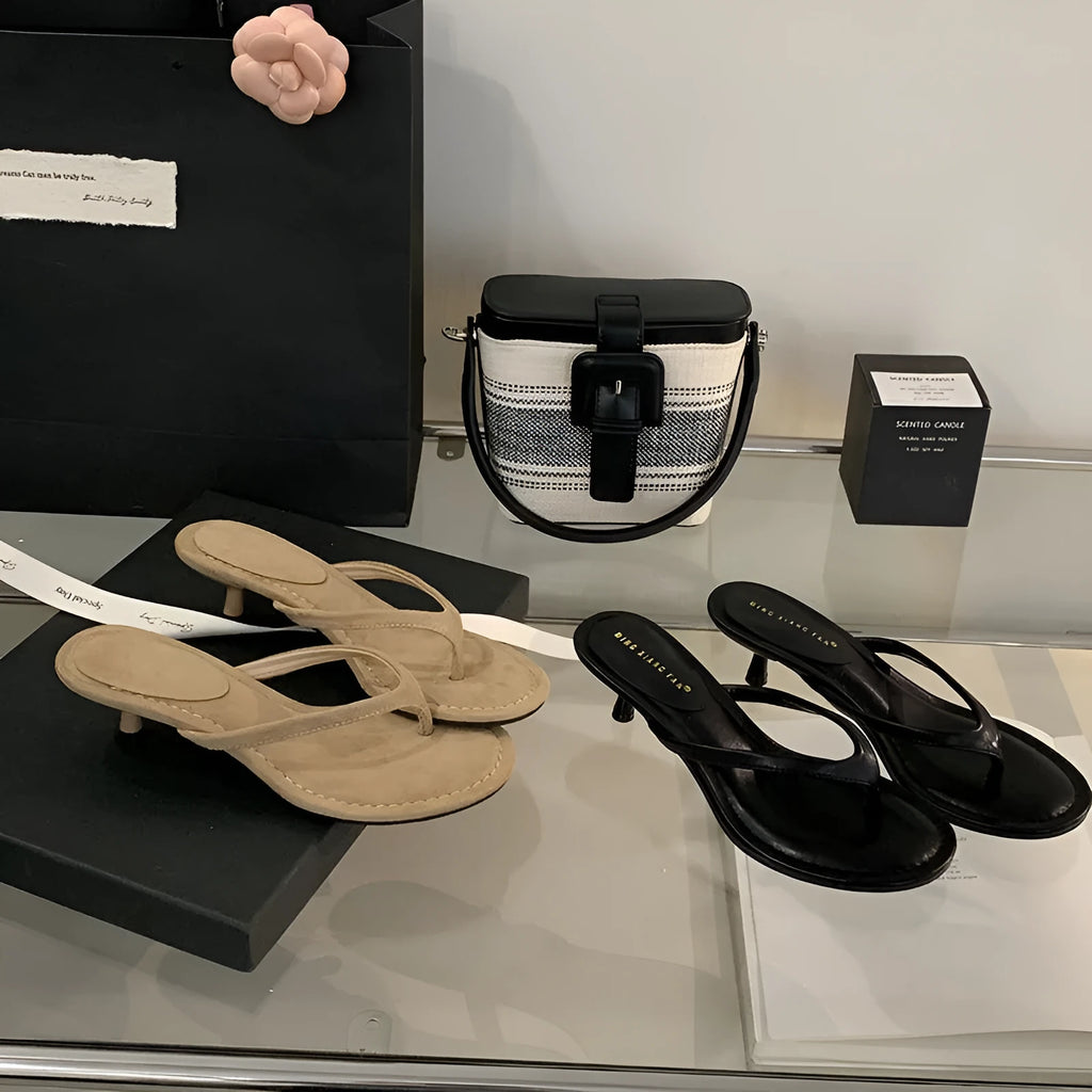 Women's stiletto flip-flop sandals in black or camel with round toe and open-toe design