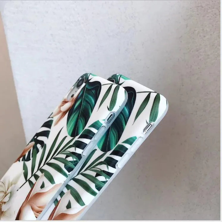 Green banana leaf floral pattern TPU phone case for iPhone on wooden surface