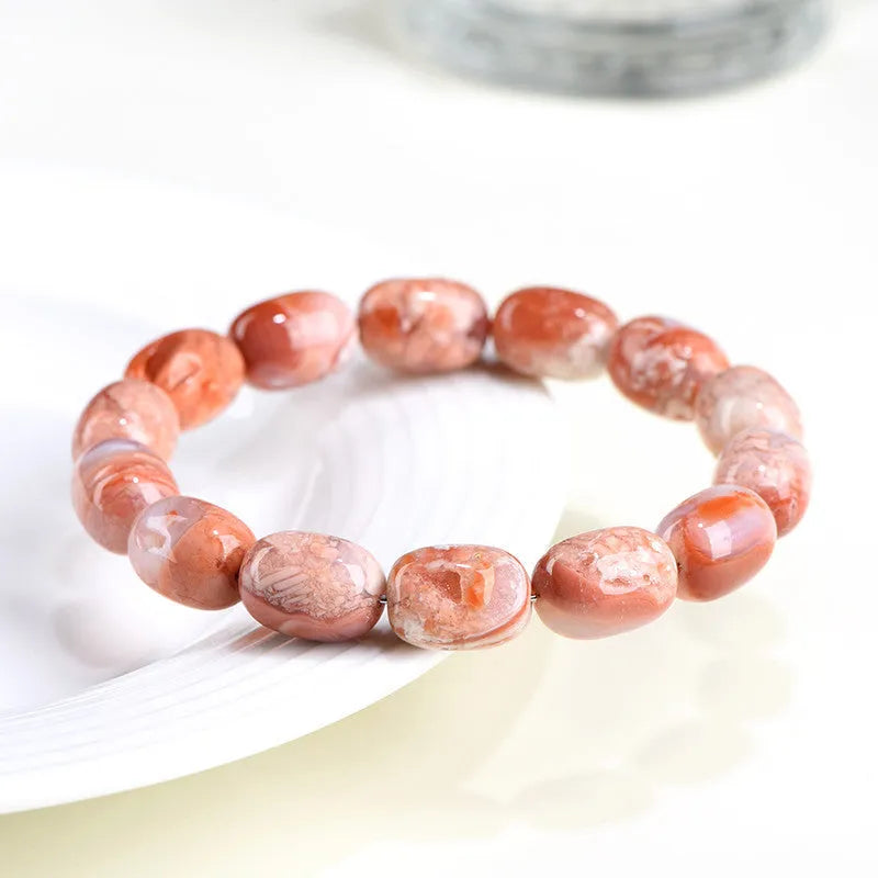 Agate barrel bead bracelet with cherry blossom colour and a ruyi element