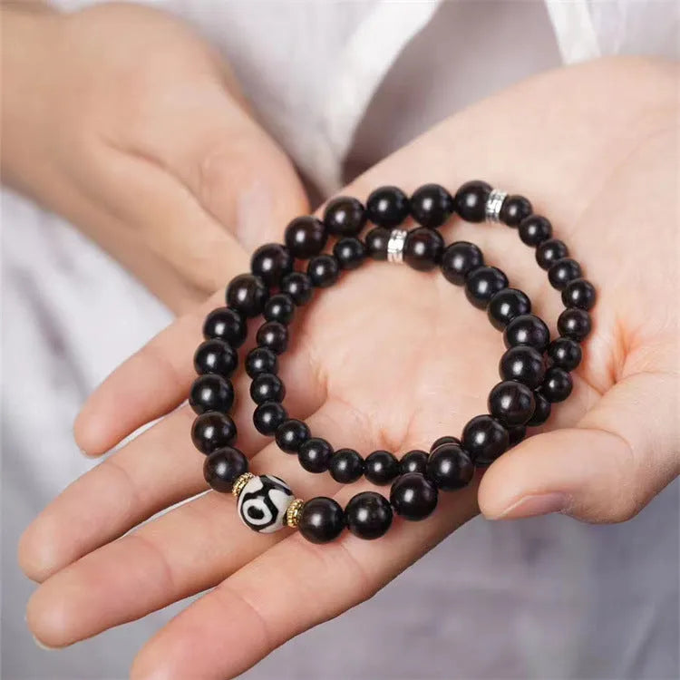 Ebony Tibetan bracelet with two circular beads in 8mm unisex sizing