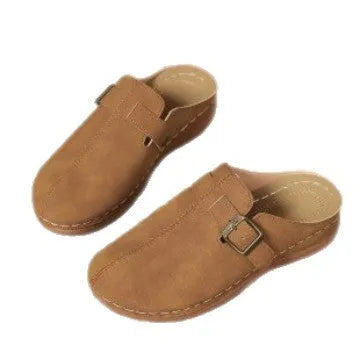 Women's casual wedge slippers in black with closed toe and rubber sole, shown from the side.
