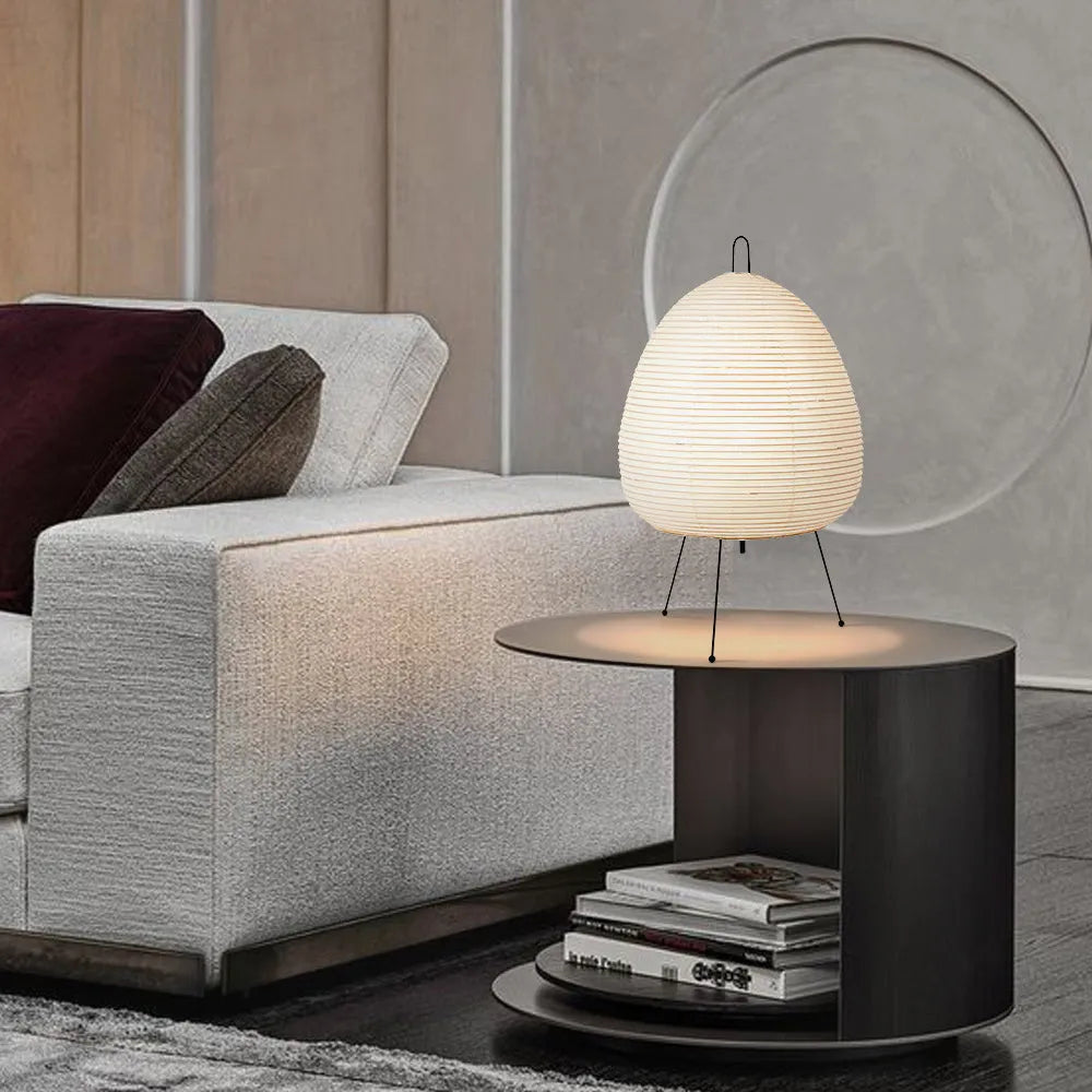 Japanese style rice paper table lamp with handmade shade and aluminium base on wooden surface