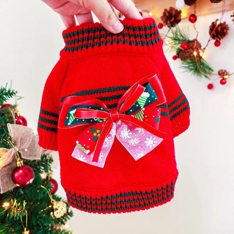 Red Christmas sweater for a small dog on a festive background, showing the 'Merry Christmas' print and pullover style.