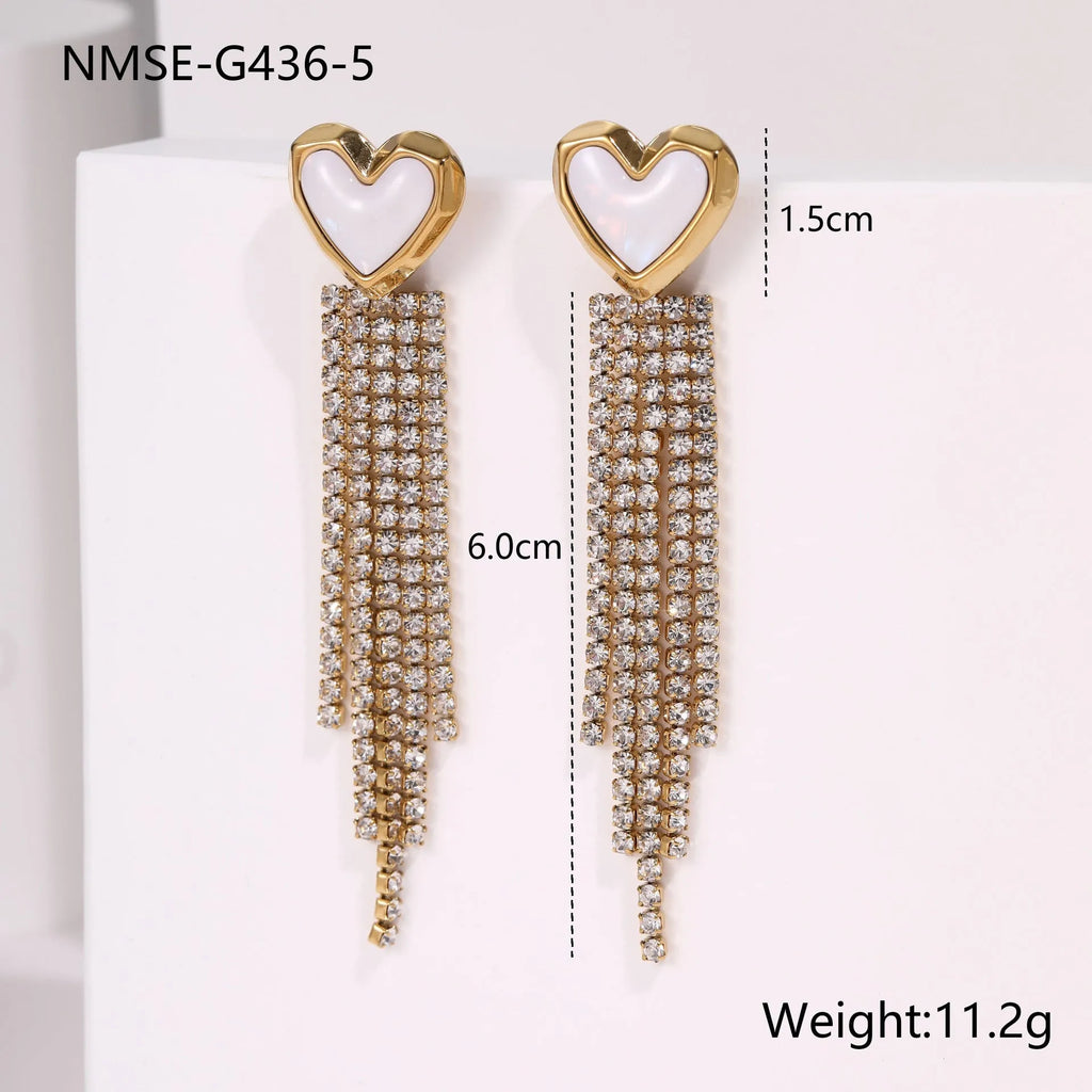 Gold-coloured stainless steel earrings with geometric heart, star, and tassel designs on a white background.