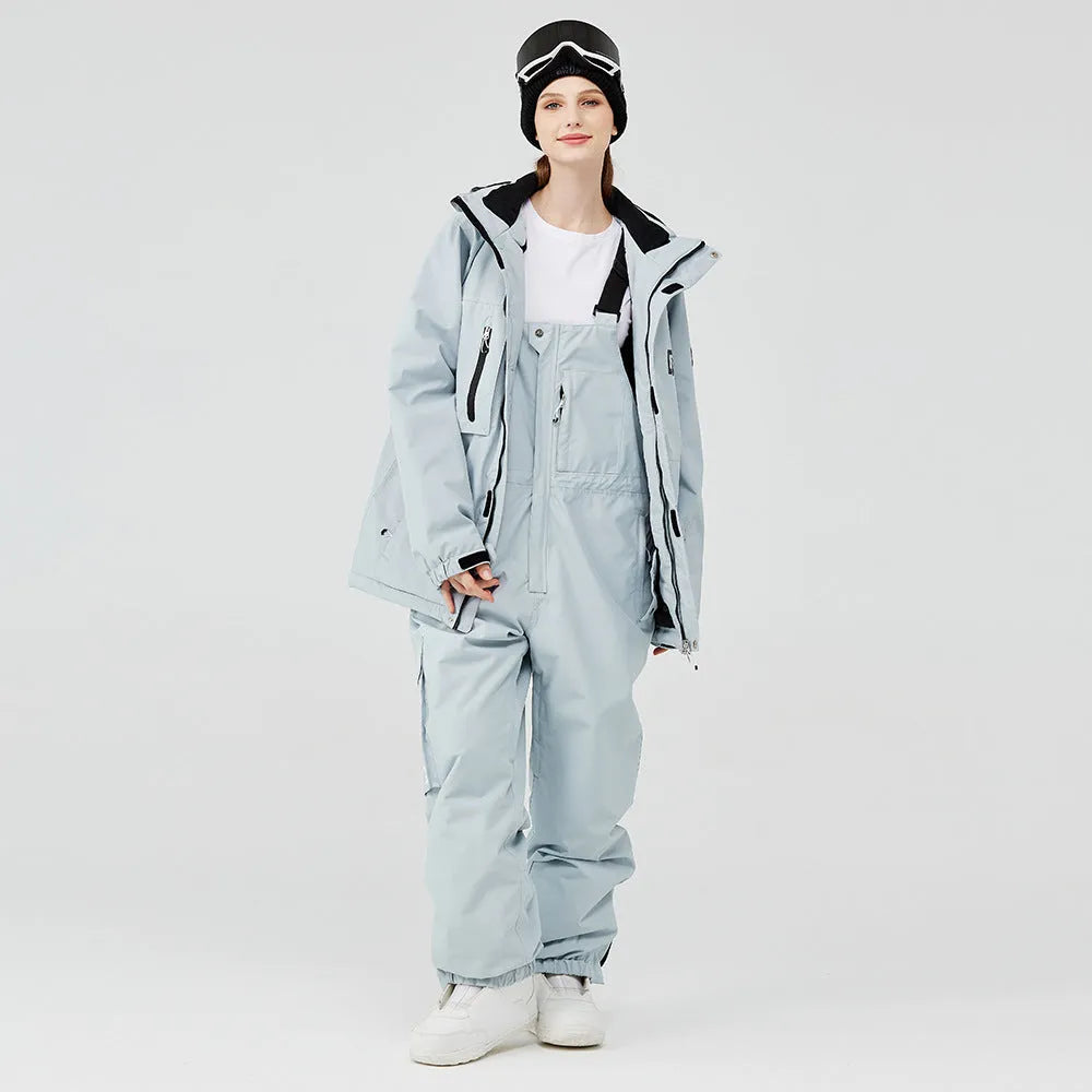 Men's and women's winter ski suit in blue top and black pants, waterproof and windproof for snow sports
