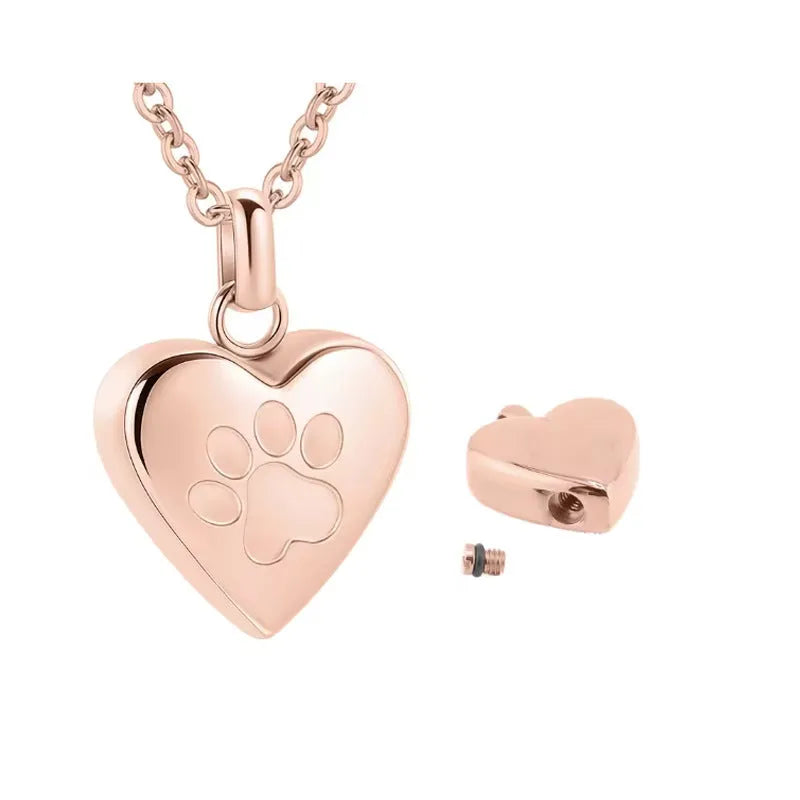 Silver heart-shaped titanium steel necklace with paw print detail and openable compartment.