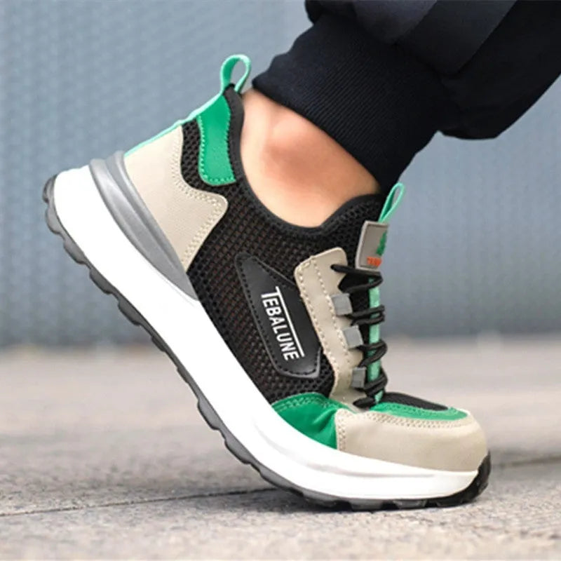 Black and green men's safety shoes with a mesh upper and plastic steel toe cap on a white background.
