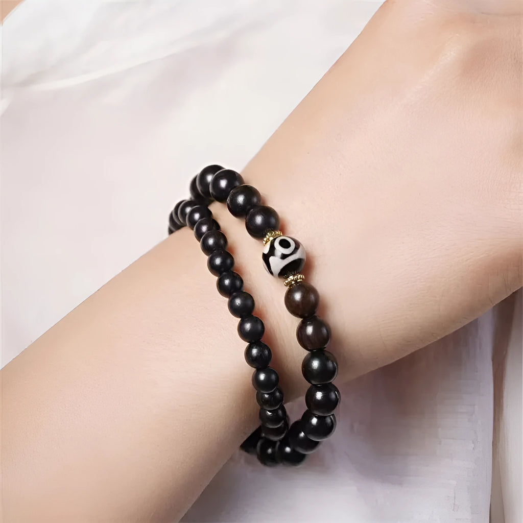 Ebony Tibetan bracelet with two circular beads in 8mm unisex sizing