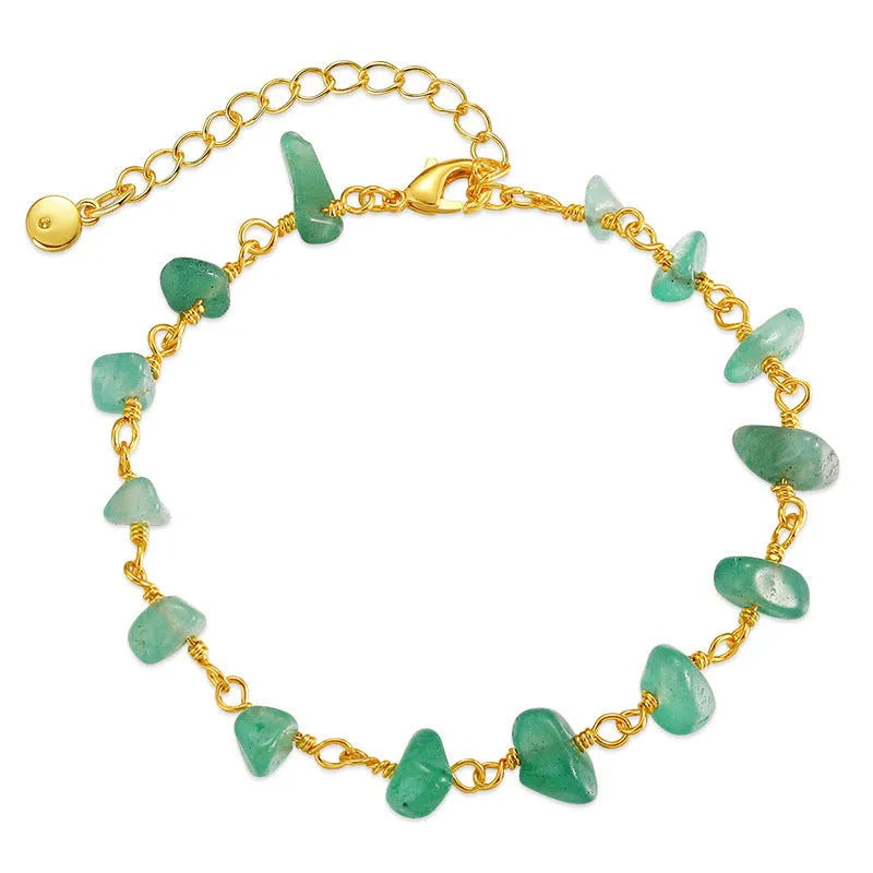 Women's geometric turquoise bracelet with irregular natural gravel stones and crystal accents on gold-plated copper
