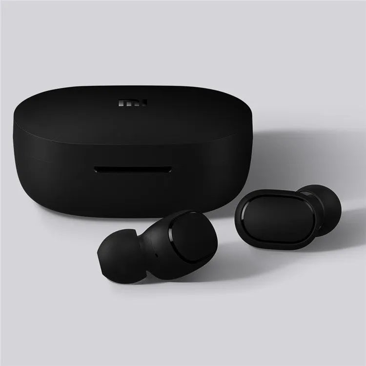 Black Redmi AirDots true wireless earbuds and charging case on a white background.