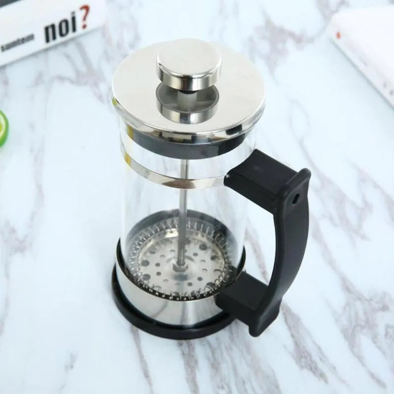 Compact stainless steel and glass drip coffee maker with 350ml capacity.