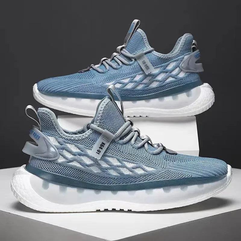 Men's low-top casual sneaker in woven mesh with flat rubber sole and front lace-up closure.