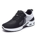 Women's striped Flyknit casual running shoes in pink with a round toe and flat PVC sole.