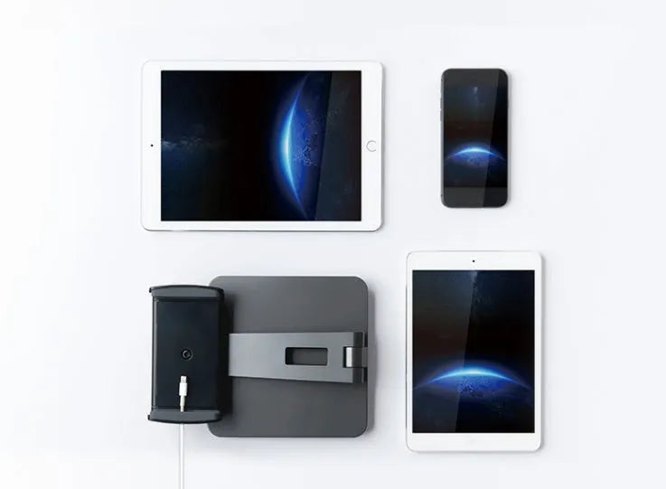 Black folding phone tablet holder with 360° rotating head on desktop