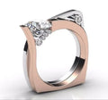 Rose gold geometric couple rings with zircon stone inlays on display
