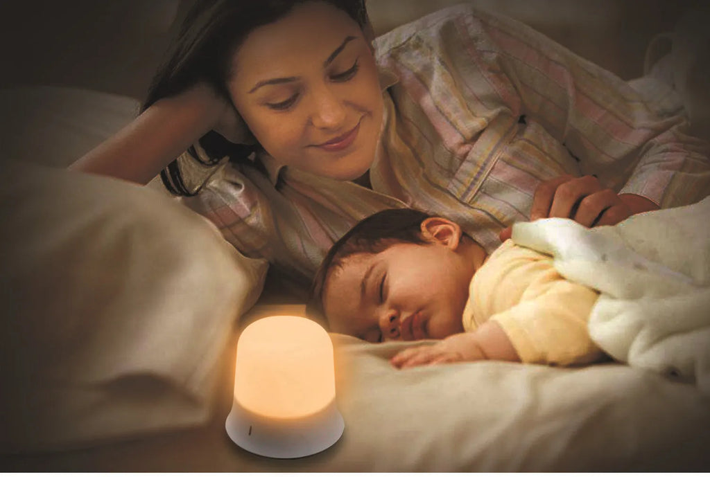 White bedside touch control night light with motion sensor, shown with warm white glow.