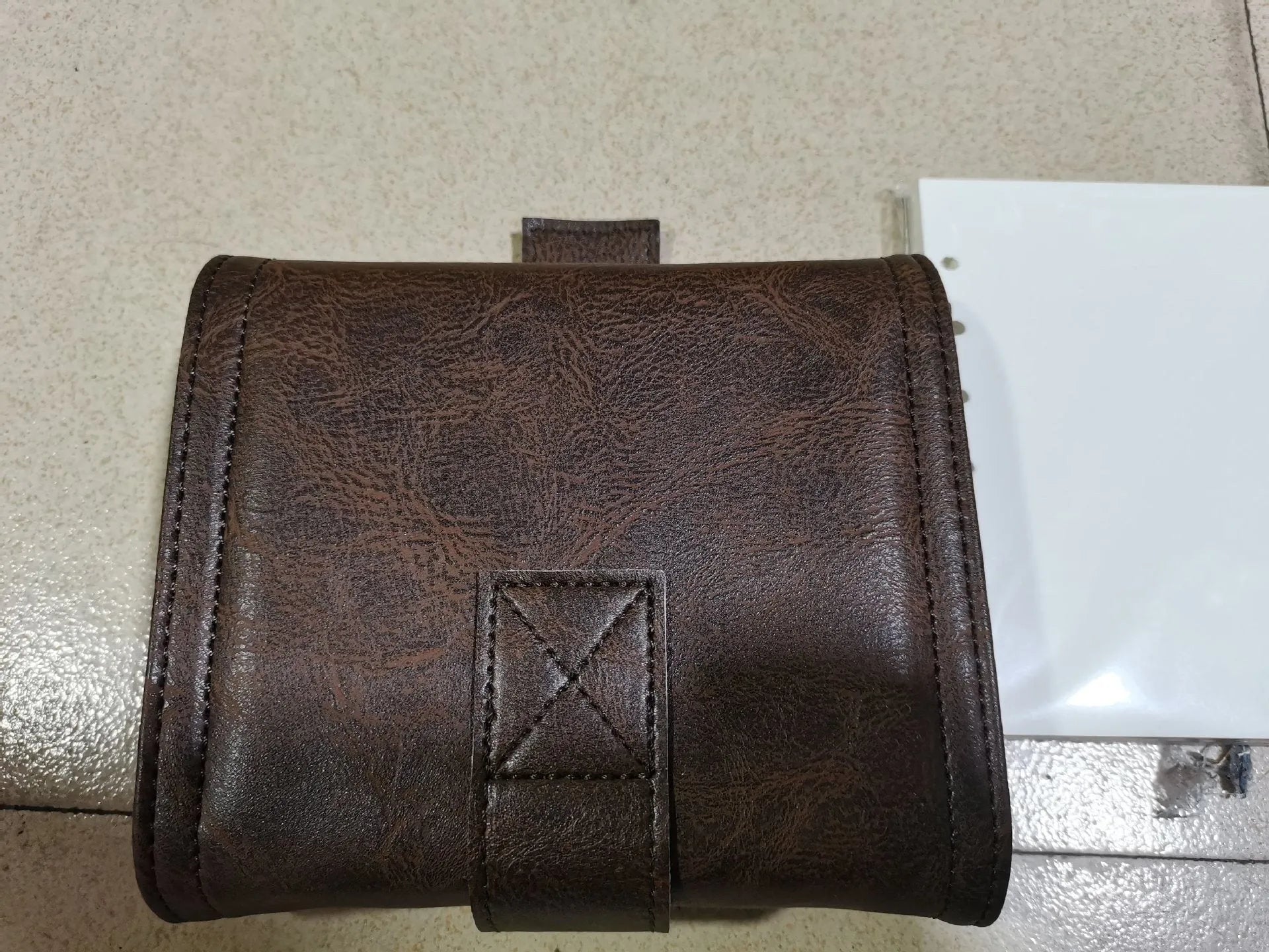 A7 brown PU leather notebook with buckle closure and loose-leaf binder binding