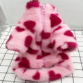 Small dog wearing British-style pink polyester plush winter coat suitable for Pomeranian or Bichon Frise breeds
