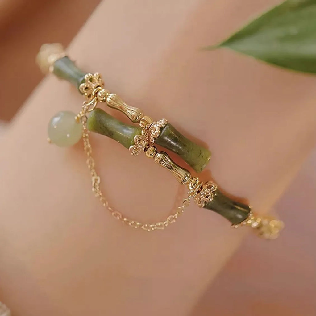 Women's bamboo bead bracelet with coloured glaze detailing in plum wine colour C208