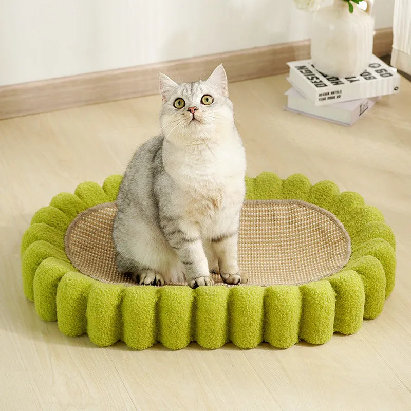 Green oval-shaped cat scratching pad with sisal fabric, serving as a lounge bed for cats.