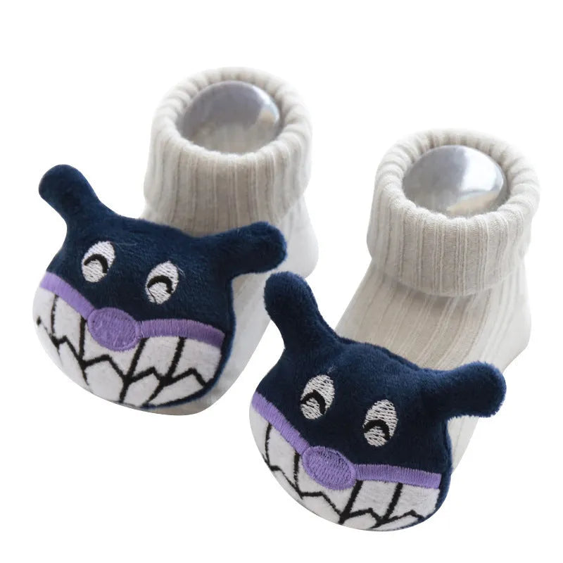 Cotton baby socks in multiple colours including blue bow and pink stars on a white background
