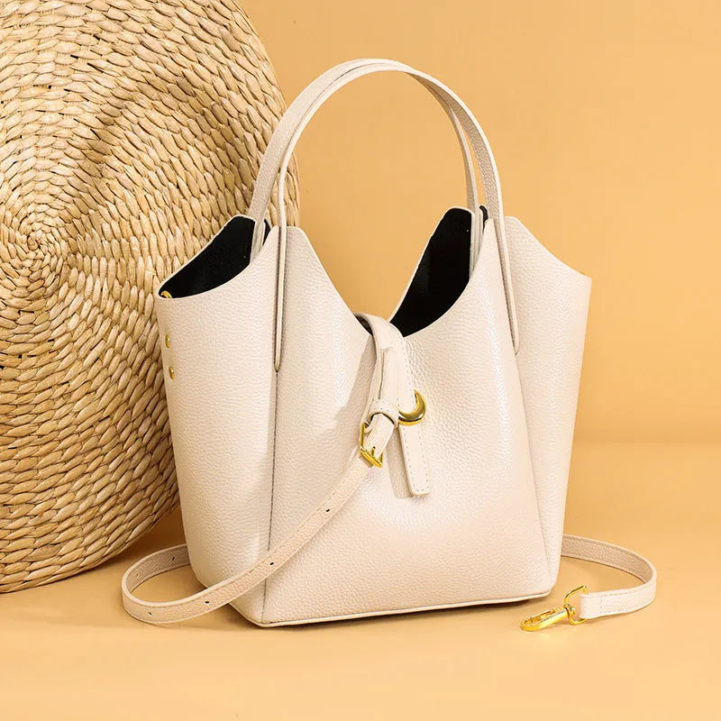 Genuine leather women's bucket bag in hand-held style with visible stitching details