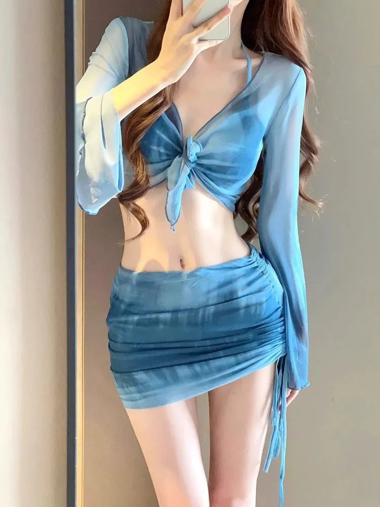 Women's blue high waist bikini four-piece swimsuit set with shirt, bra, underwear and skirt components