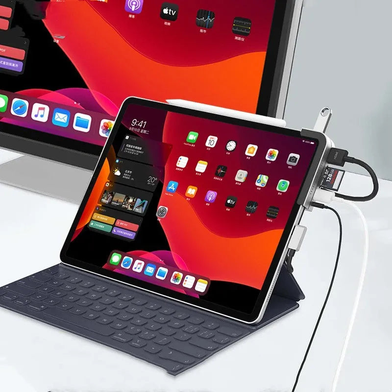 Silver aluminium grey USB-C docking station and multi-port converter for iPad Pro models.