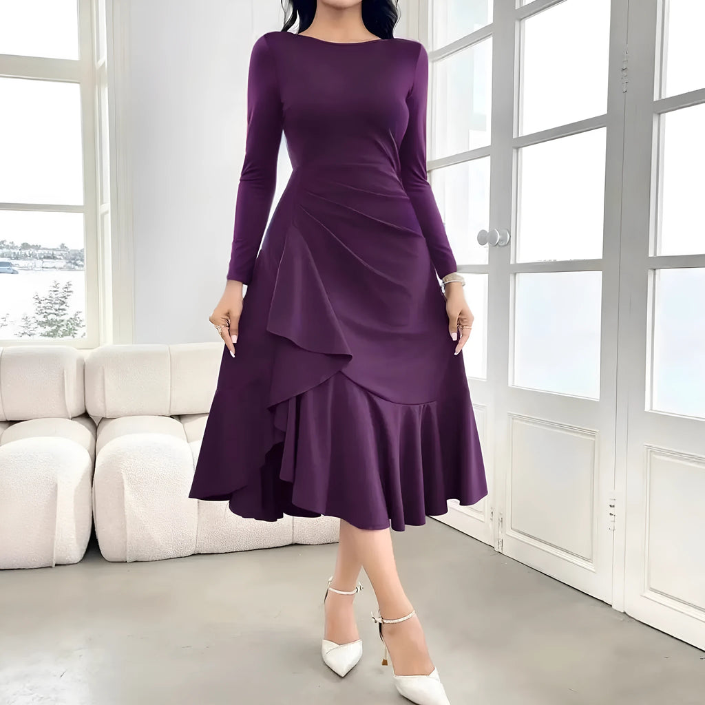 Purple women's dress with ruffle detailing, long sleeves, and round neck in mid waist design