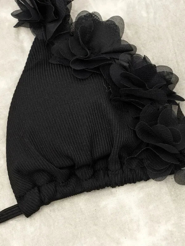 Black women's gathered two-piece polyester swimsuit bikini set on a mannequin