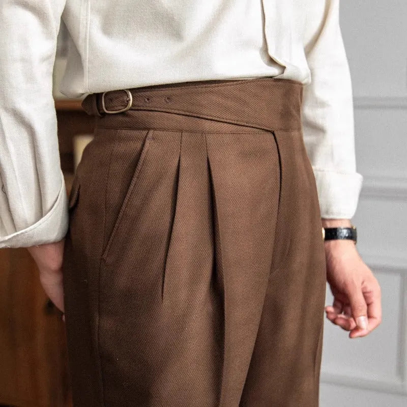 Man wearing black high-waist straight-leg casual polyester trousers for leisure.