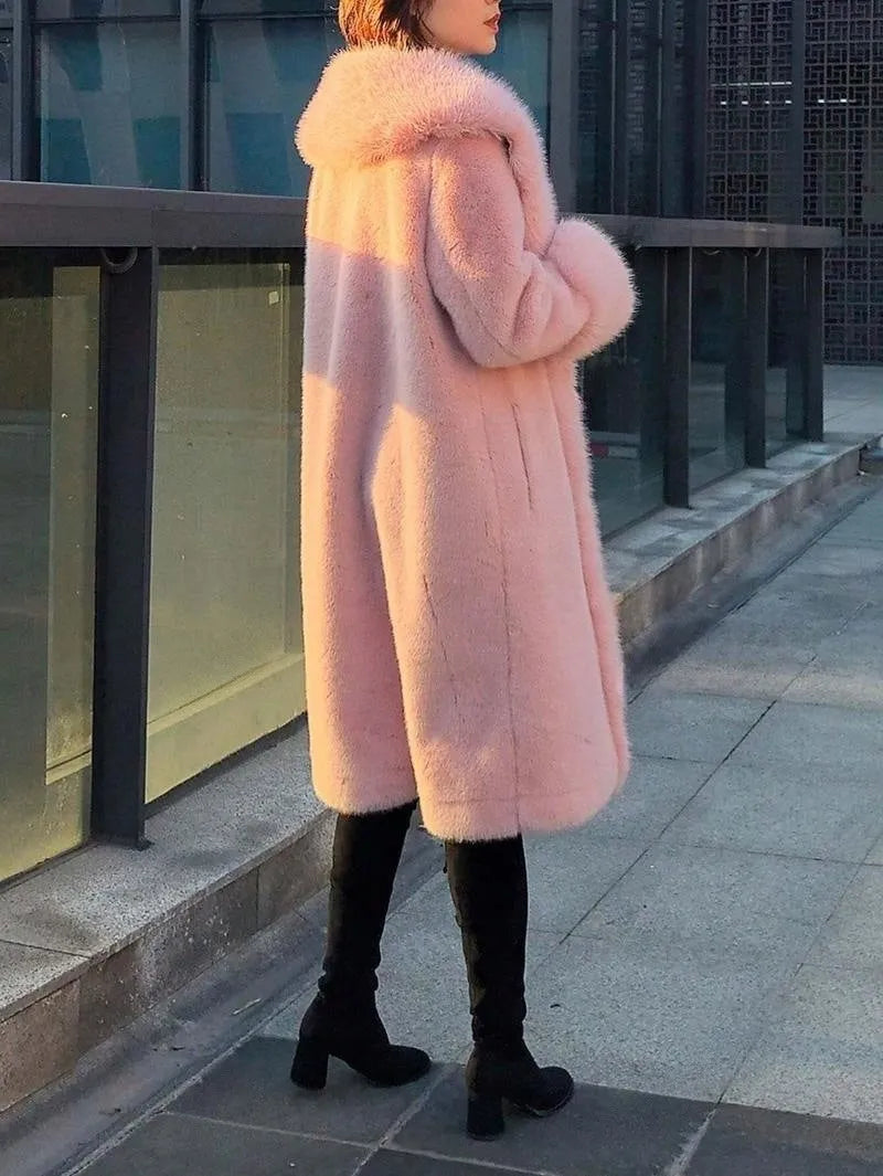 A grey women's mid-length coat with thick faux rabbit fur and a matching fur collar.