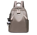 Medium-sized wine red Oxford cloth rucksack showing front view and internal organiser pockets.