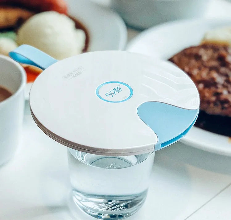 A slim, portable baby bottle sterilizer in blue or pink, showing USB port and compact design.