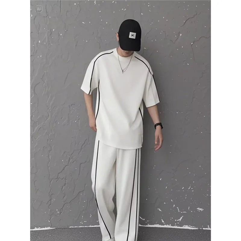 Summer women's sporty casual two-piece set in black suit with colour-blocking trim, short sleeve top and long pants
