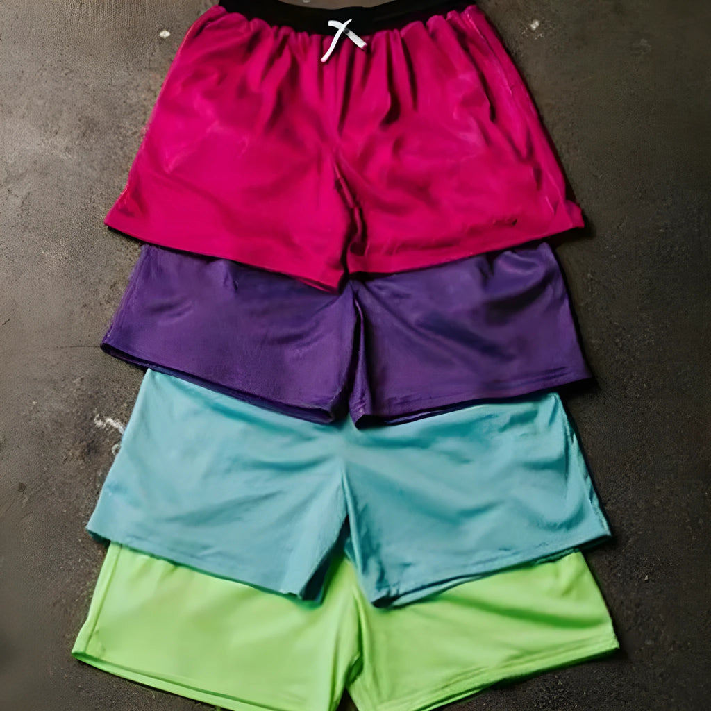 Men's solid colour mesh quick-drying shorts in black, shown laid flat.