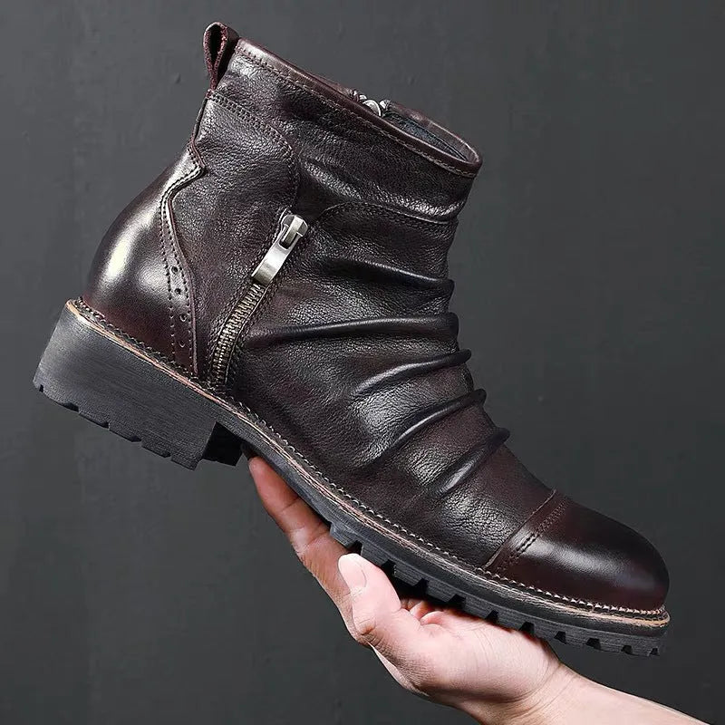 Men's black cowboy boots with side zipper, embossed texture, round toe, and a medium horseshoe heel.
