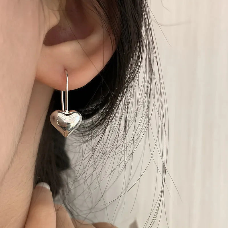 Korean-style copper heart earrings with 3D glossy finish and silver heart-shaped ear hooks