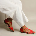 Red women's casual summer sandals with a square buckle and herringbone toe holder on an artificial PU upper.