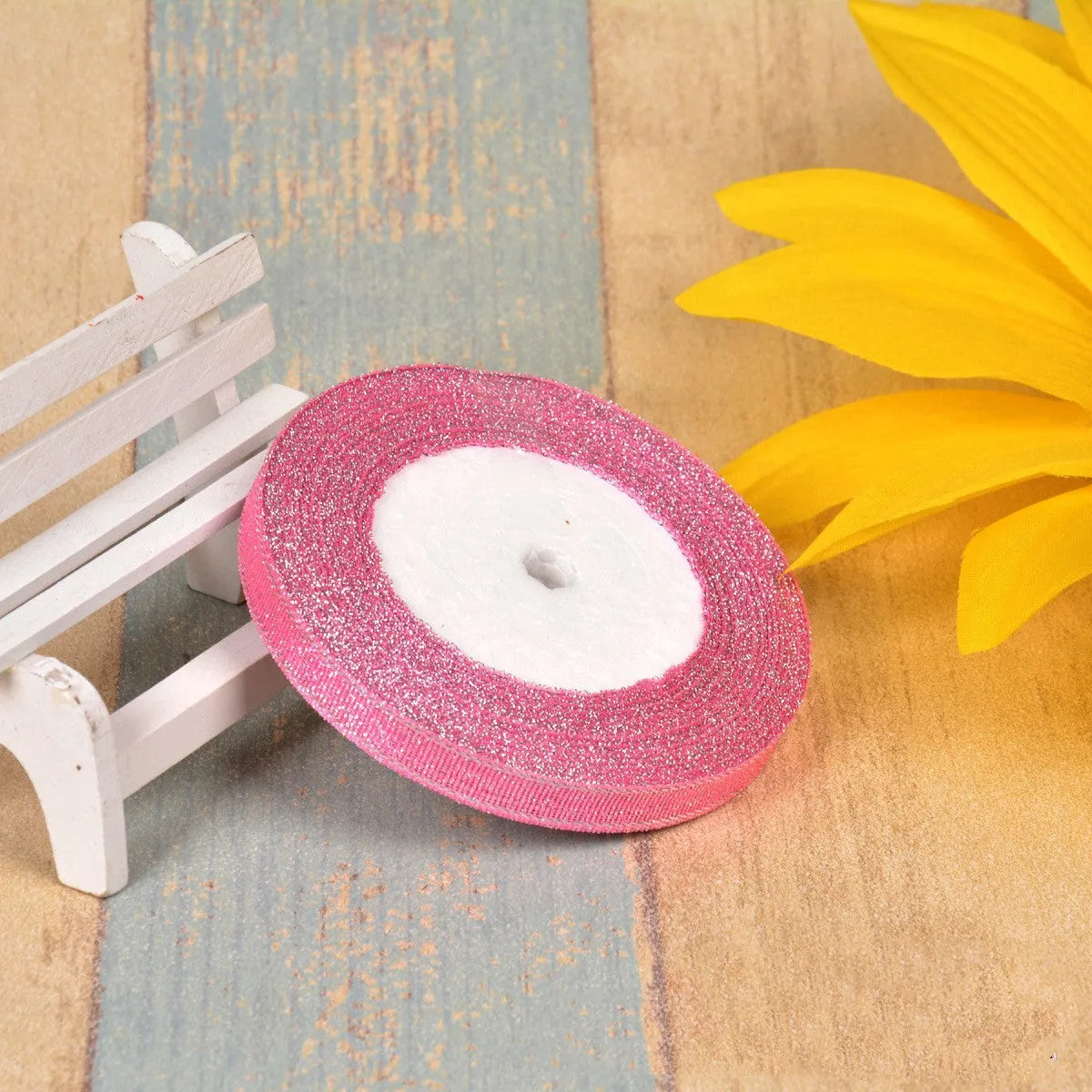 Green onion coloured polyester ribbon with gold polka dots on 25-yard spool for decorative trimming